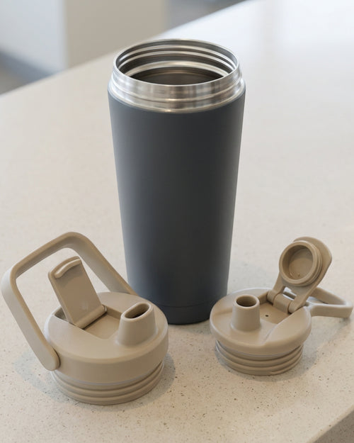 Mvabv Twenty Two Ounce Travel Tumbler with Flip Chug Spout and Carry Bail Slate - Lifestyle view
